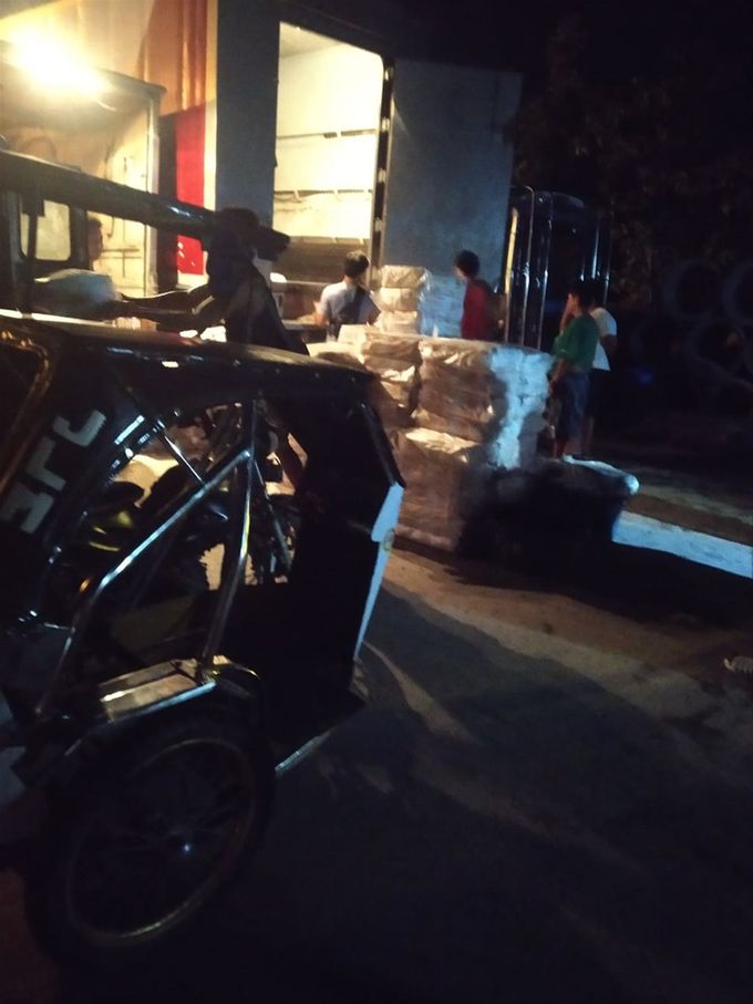 Boxes of fish unloaded at the duplex in the wee hours of the morning. (photo by Jheng)